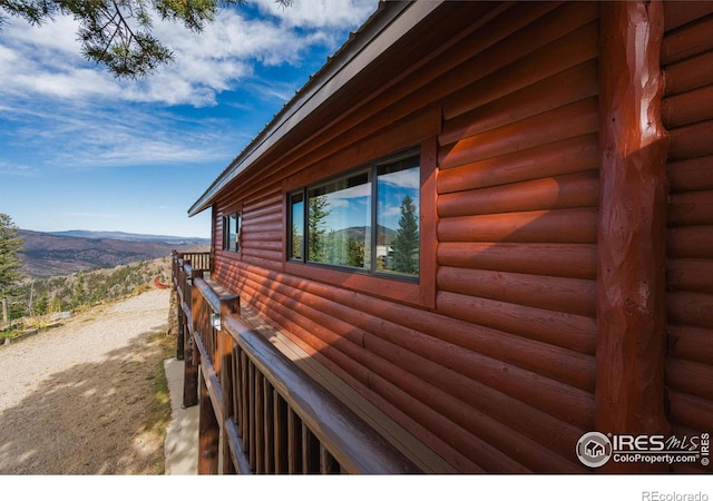 view of property exterior featuring a mountain view