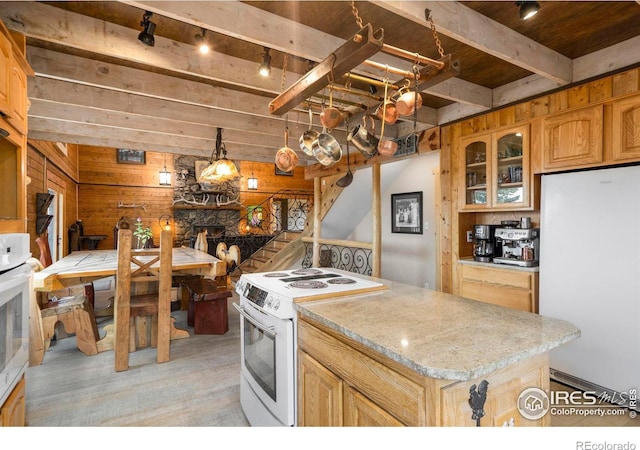 kitchen featuring white appliances, a kitchen island, wooden ceiling, beamed ceiling, and wood walls