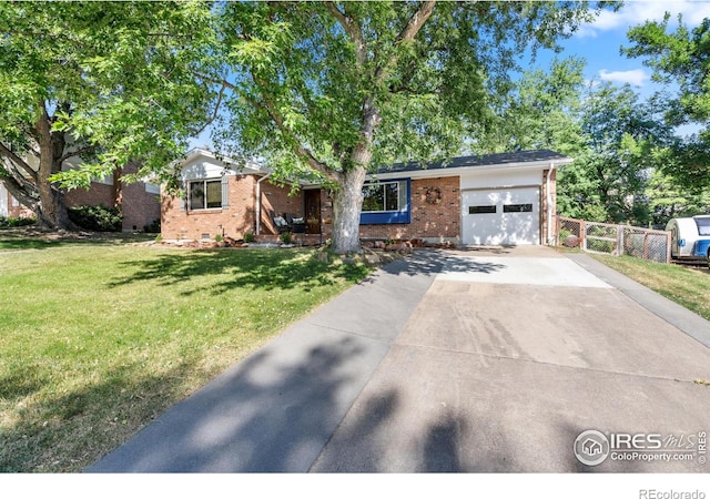 view of front of property with a front lawn and a garage