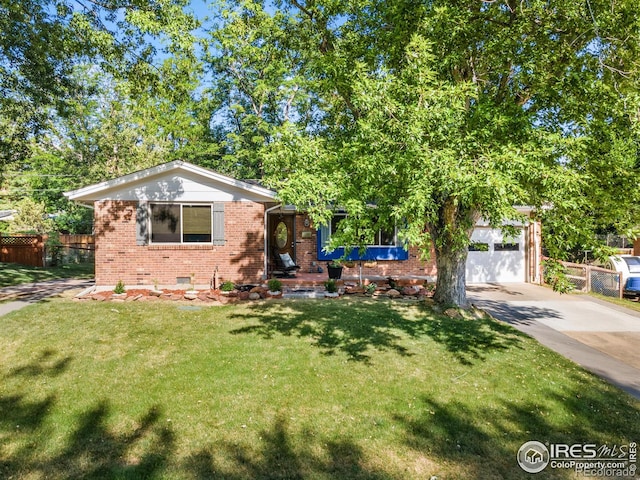 view of front of home featuring a garage and a front yard