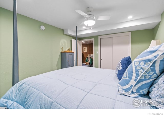 bedroom featuring ceiling fan and a closet