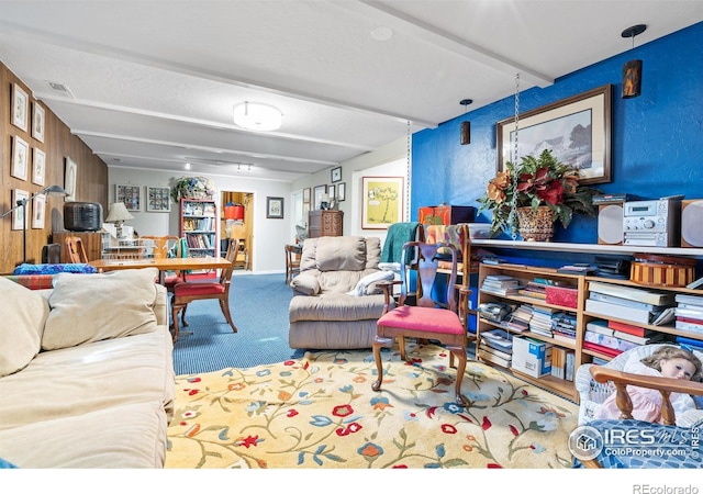 interior space with carpet and beamed ceiling