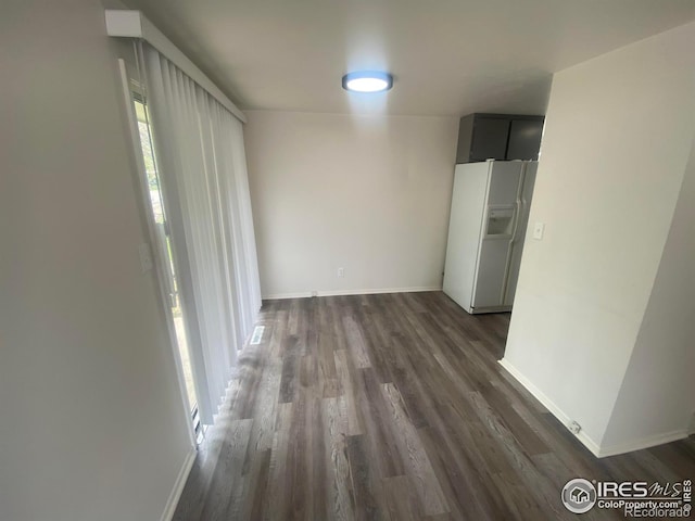 hallway with dark hardwood / wood-style floors