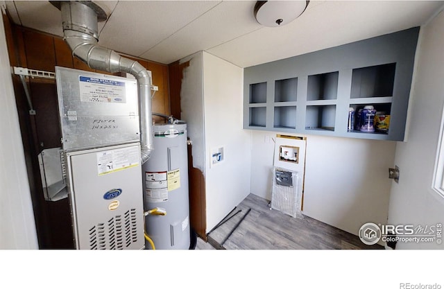 utility room with water heater and heating unit