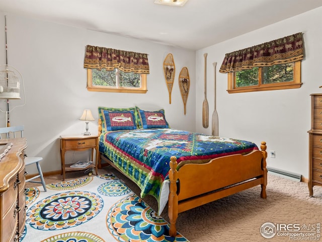 carpeted bedroom featuring a baseboard radiator