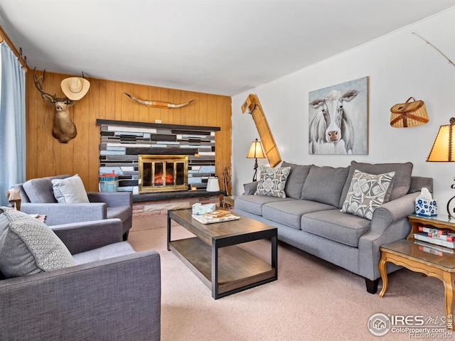 living room featuring carpet flooring and wooden walls