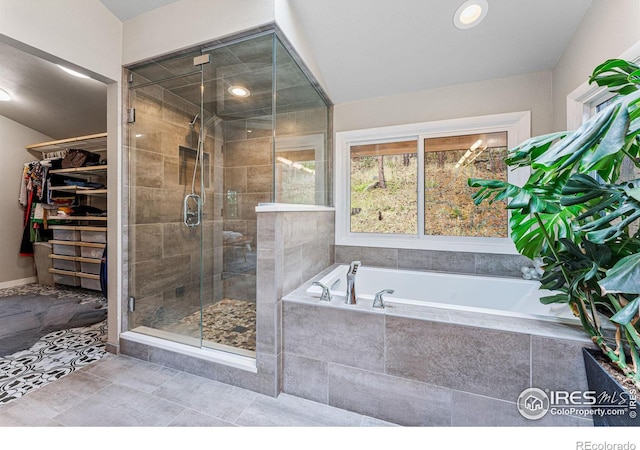 bathroom featuring tile patterned floors and plus walk in shower