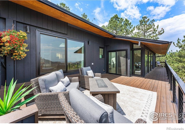 wooden deck featuring an outdoor living space