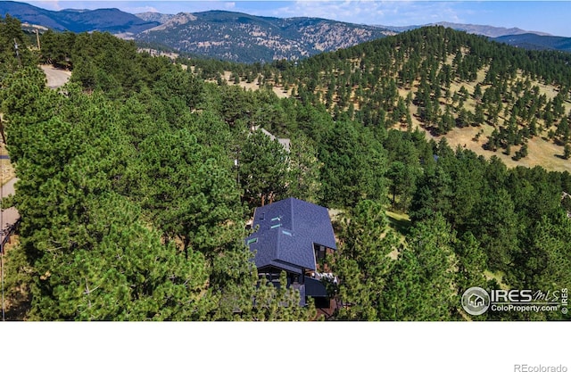 birds eye view of property with a mountain view