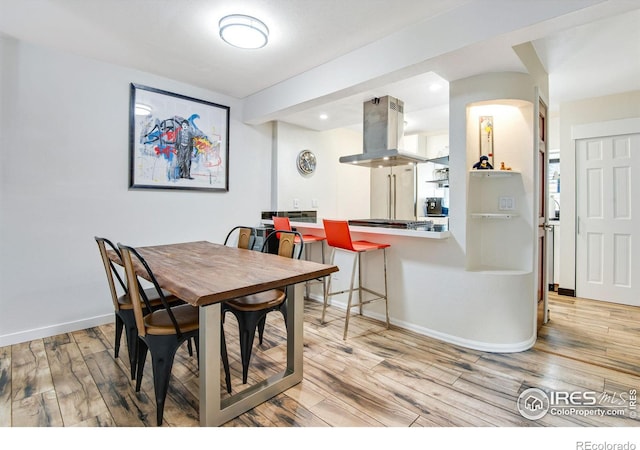 dining room featuring light hardwood / wood-style flooring