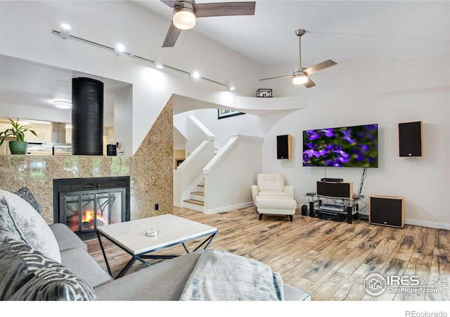 living room featuring ceiling fan and wood-type flooring