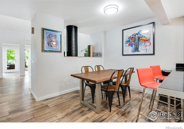 dining room with light wood-type flooring