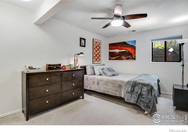 carpeted bedroom with ceiling fan