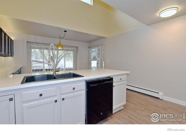 kitchen with sink, white cabinets, a baseboard radiator, pendant lighting, and black dishwasher