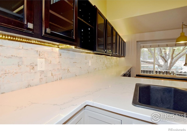 kitchen featuring light stone counters and decorative backsplash