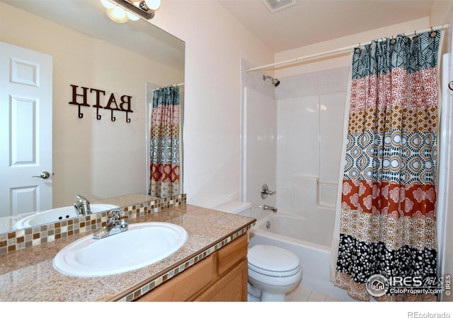 full bathroom with tile patterned flooring, vanity, shower / bath combination with curtain, and toilet