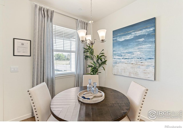 dining area featuring an inviting chandelier