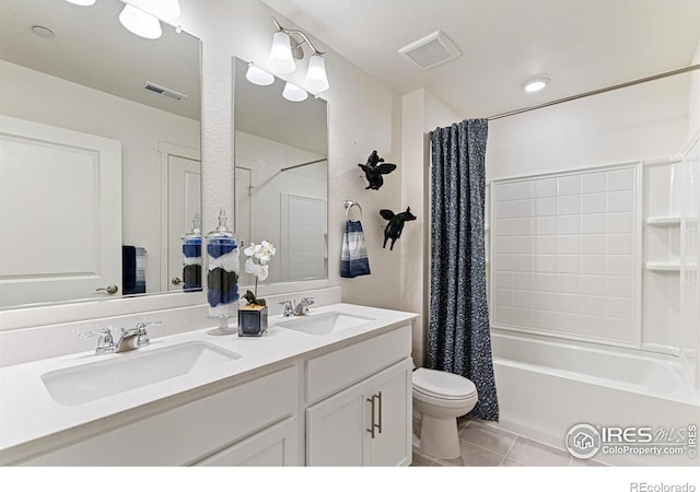 full bathroom with tile patterned floors, toilet, shower / tub combo, and vanity