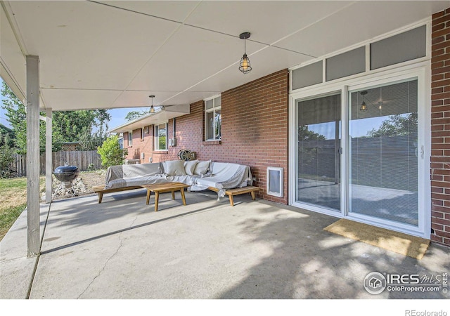 view of patio with fence and an outdoor living space