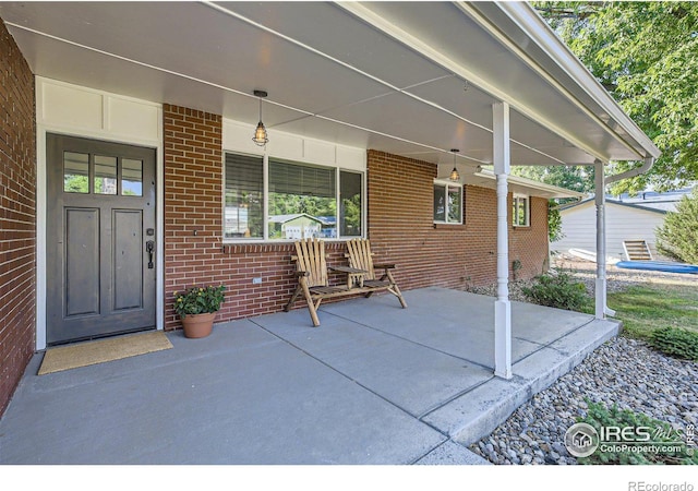 view of patio featuring a porch