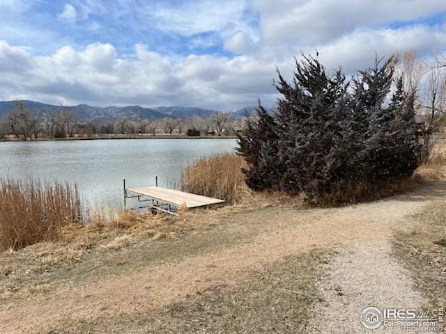 dock area featuring a water and mountain view