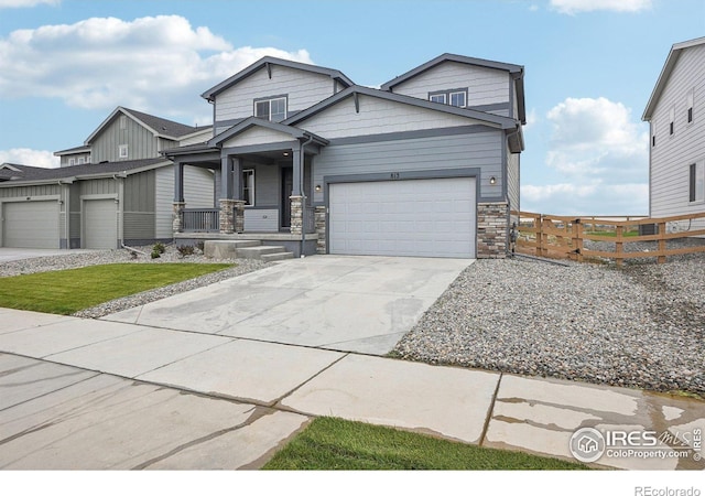 view of front facade with a garage and a porch