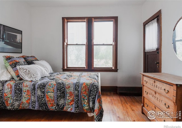 bedroom with light hardwood / wood-style floors