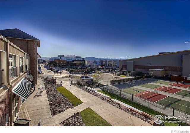 view of patio featuring tennis court