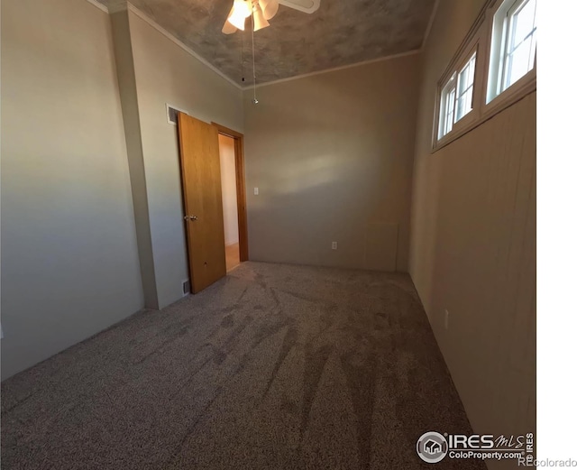 619 Curtis St, Brush, CO 80723 - unfurnished room with ornamental molding, a ceiling fan, and carpet floors