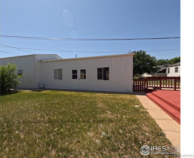 619 Curtis St, Brush, CO 80723 - rear view of house featuring a yard and a deck