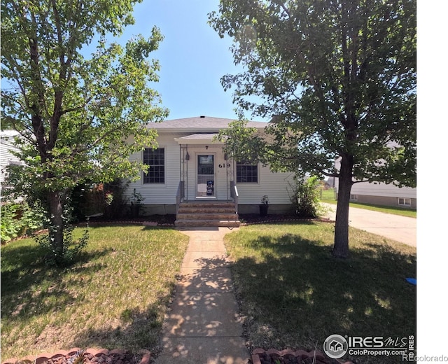 619 Curtis St, Brush, CO 80723 - view of front of house featuring a front yard