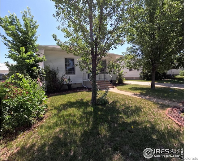 619 Curtis St, Brush, CO 80723 - view of front facade with a front lawn