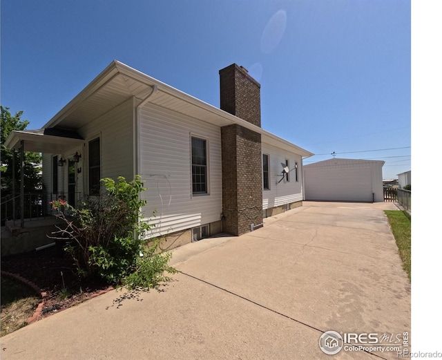 619 Curtis St, Brush, CO 80723 - view of home's exterior with a chimney