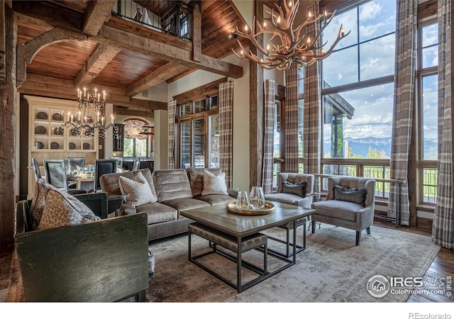 living area featuring arched walkways, wooden ceiling, wood finished floors, beam ceiling, and an inviting chandelier