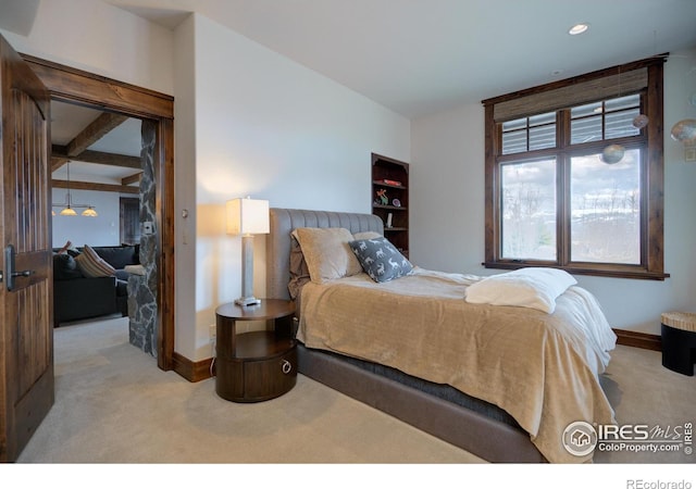 carpeted bedroom featuring baseboards