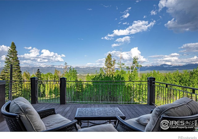 wooden terrace with a mountain view