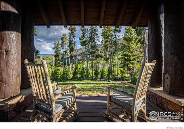 wooden terrace with a forest view