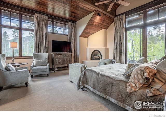 carpeted bedroom featuring vaulted ceiling, wooden ceiling, and access to exterior