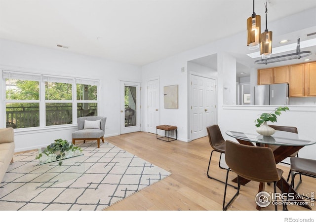 living room with light hardwood / wood-style flooring