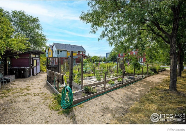 view of playground with a vegetable garden