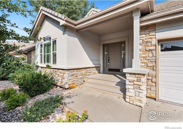 property entrance with a garage