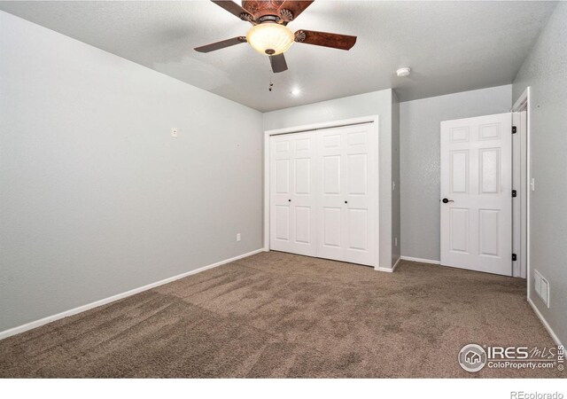 unfurnished bedroom featuring a closet, carpet floors, and ceiling fan