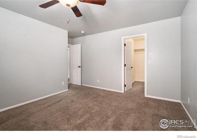 unfurnished room featuring carpet floors and ceiling fan