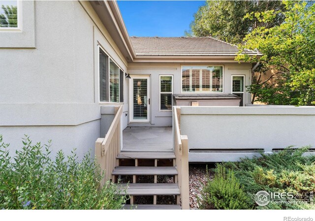 doorway to property featuring a deck