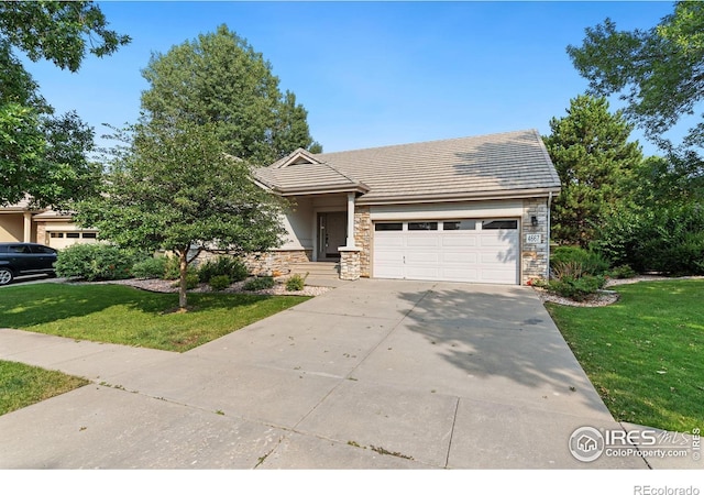 view of front facade with a garage and a front yard