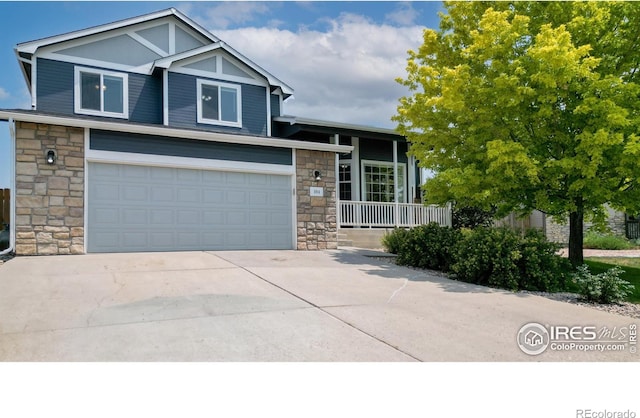 view of front of property with a garage and a porch