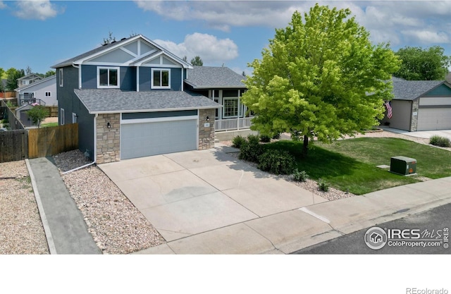 view of front of house with a garage and a front yard