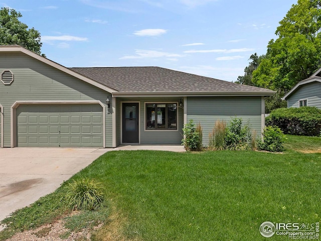 ranch-style house with a garage and a front yard