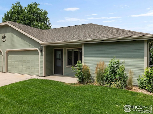 single story home with a garage and a front yard