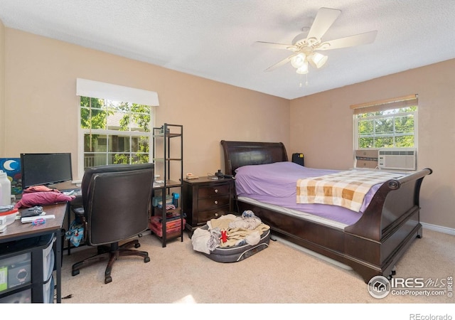 3300 Madison Ave, Boulder, CO 80303 - carpeted bedroom with baseboards, cooling unit, ceiling fan, and a textured ceiling